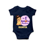 My First Raksha Bandhan Baby Girl Romper – girl sitting with Rakhi theme. - NAVY BLUE - New Born (Chest 14")