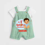 My First Raksha Bandhan Baby Boy Dungaree– boy sitting with Rakhi theme. - MINT GREEN - 0 - 5 Months Old (Chest 18")