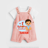 My First Raksha Bandhan Baby Boy Dungaree– boy sitting with Rakhi theme. - PEACH - 0 - 5 Months Old (Chest 18")