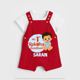 My First Raksha Bandhan Baby Boy Dungaree– boy sitting with Rakhi theme. - RED - 0 - 5 Months Old (Chest 18")