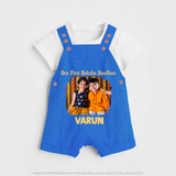 Our First BhaiDooj Together Dungaree – happy siblings hugging. - COBALT BLUE - 0 - 5 Months Old (Chest 18")