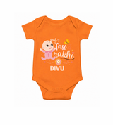 My First Rakhi Baby Boy Cute Graphic Romper – baby with “my first rakhi” illustration.