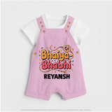 Bhaiya-Bhabhi Fun Rakhi Print Dungaree – cartoon style with “Bhaiya-Bhabhi” text and playful elements. - BABY PINK - 0 - 5 Months Old (Chest 18")