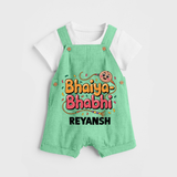 Bhaiya-Bhabhi Fun Rakhi Print Dungaree – cartoon style with “Bhaiya-Bhabhi” text and playful elements. - GREEN - 0 - 5 Months Old (Chest 18")