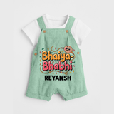Bhaiya-Bhabhi Fun Rakhi Print Dungaree – cartoon style with “Bhaiya-Bhabhi” text and playful elements. - MINT GREEN - 0 - 5 Months Old (Chest 18")