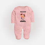 First Rakhi CelebrationBrother Sister Print Fullbody Suit – simple baby holding rakhi illustration. - BABY PINK - New Born (Chest 7.5")