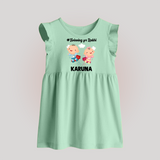 Twinning for Rakhi Print Baby Frock – two baby superheroes flying together. - MINT GREEN - 0 - 3 Months Old (Chest 17")