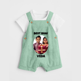 Pamper Me with Gift Rakhi Print Dungaree – brother-sister gift giving illustration. - MINT GREEN - 0 - 5 Months Old (Chest 18")