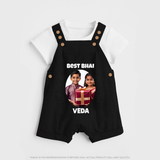Pamper Me with Gift Rakhi Print Dungaree – brother-sister gift giving illustration. - BLACK - 0 - 5 Months Old (Chest 18")