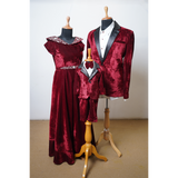 Regal Wine Velvet Family Partywear Set featuring wine velvet gown, men’s tuxedo jacket, and matching boy’s tuxedo suit.
