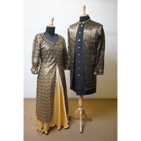 Black and gold embroidered jacket gown and sherwani couple outfit on mannequins