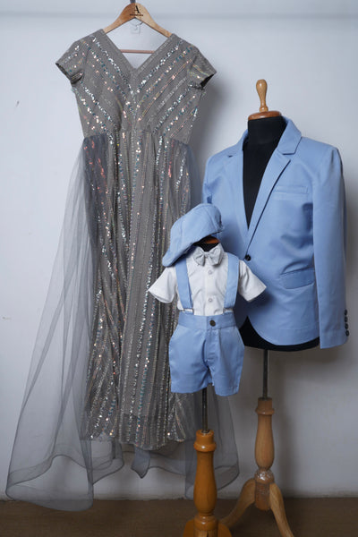 Family matching outfits with grey sequin gown, pastel blue men’s shirt, and baby boy suspenders