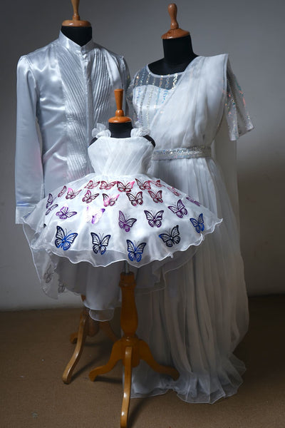 White family outfit set with butterfly frock, shimmer saree gown, and satin kurta