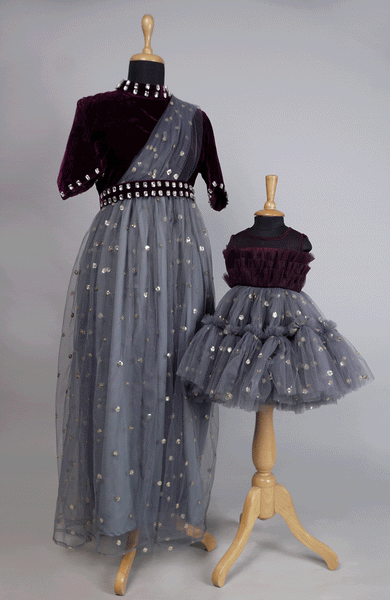 Regal maroon velvet and grey net mom and baby girl matching outfit set with mirror work and sequin accents.