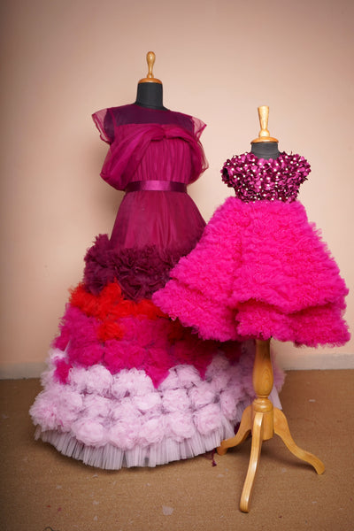 Majestic Magenta & Pink Ruffle Gown Set for Mother & Daughter with layered ruffle skirt and sequin embellished top.