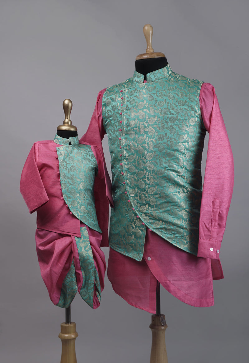 Father-son coordinated kurta dhoti set with pink kurta, green brocade jacket, and matching pink dhoti pants