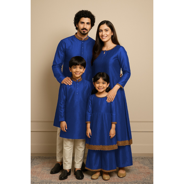 Indian family wearing coordinated raw silk ethnic outfits with golden lace detailing — dad in kurta, mom in Anarkali set, son in kurta, and daughter in frock and palazzo — festive family ethnic wear set.