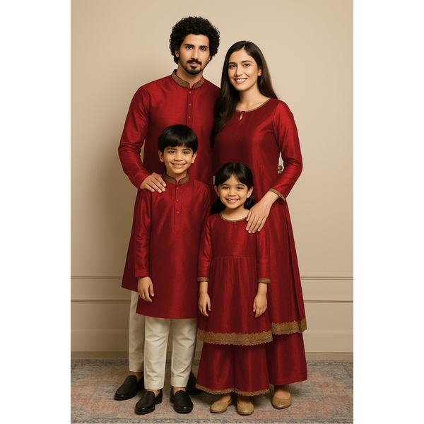 Indian family wearing coordinated raw silk ethnic outfits with golden lace detailing — dad in kurta, mom in Anarkali set, son in kurta, and daughter in frock and palazzo — festive family ethnic wear set.