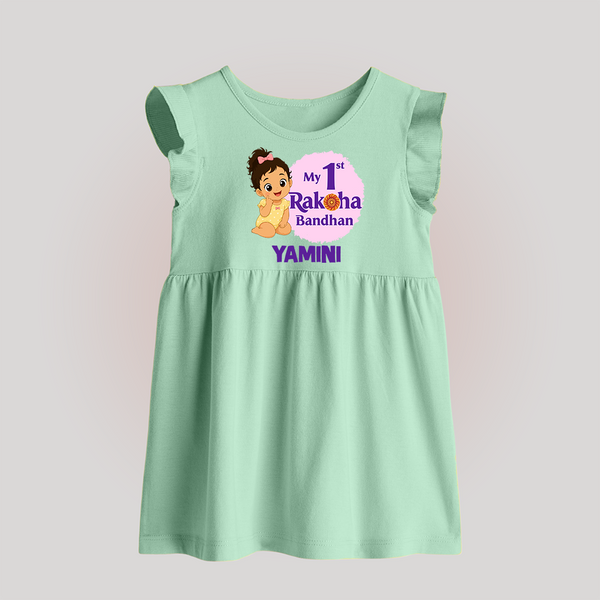 My First Raksha Bandhan Baby Girl Baby Frock – girl sitting with Rakhi theme. - MINT GREEN - 0 - 3 Months Old (Chest 17")