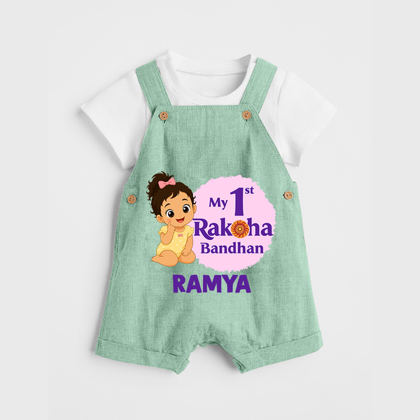 My First Raksha Bandhan Baby Girl Dungaree – girl sitting with Rakhi theme. - MINT GREEN - 0 - 5 Months Old (Chest 18")