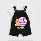 My First Raksha Bandhan Baby Girl Dungaree – girl sitting with Rakhi theme. - BLACK - 0 - 5 Months Old (Chest 18")
