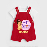 My First Raksha Bandhan Baby Girl Dungaree – girl sitting with Rakhi theme. - RED - 0 - 5 Months Old (Chest 18")