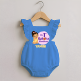 My First Raksha Bandhan Baby Girl Romper Frock – girl sitting with Rakhi theme.