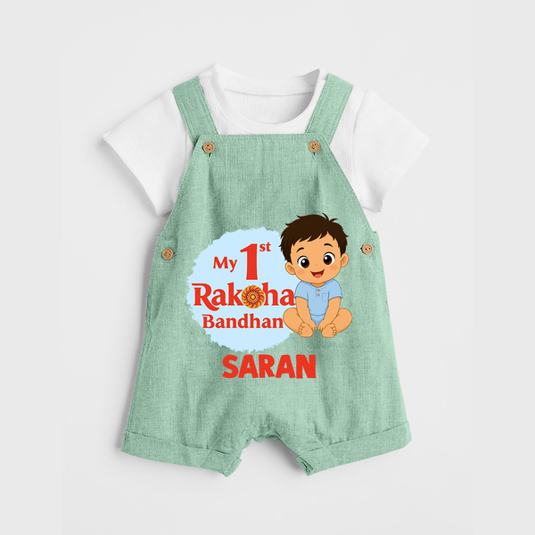 My First Raksha Bandhan Baby Boy Dungaree– boy sitting with Rakhi theme. - MINT GREEN - 0 - 5 Months Old (Chest 18")