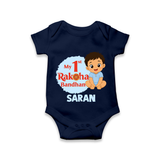 My First Raksha Bandhan Baby Boy Romper – boy sitting with Rakhi theme. - NAVY BLUE - New Born (Chest 14")