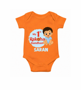 My First Raksha Bandhan Baby Boy Romper – boy sitting with Rakhi theme.