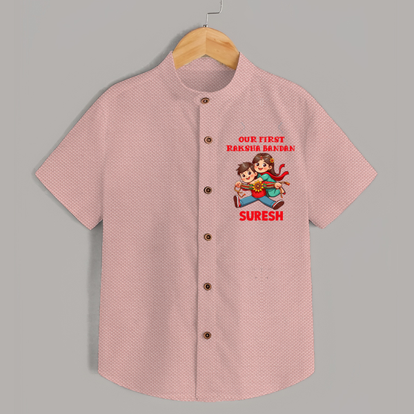 Our First Raksha Bandhan Sibling Shirt – brother & sister holding Rakhi. - PEACH - 0 - 6 Months Old (Chest 23")