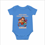 Our First Raksha Bandhan Sibling Romper  – brother & sister holding Rakhi.