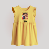 My First Rakhi Baby Girl Cute Graphic Baby Frock – baby with my first rakhi illustration. - PASTEL YELLOW - 0 - 3 Months Old (Chest 17")