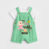 My First Rakhi Baby Boy Cute Graphic Dungaree – baby with “my first rakhi” illustration. - GREEN - 0 - 5 Months Old (Chest 18")
