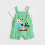 Happy Rakhi Baby Siblings Graphic Dungaree – playful sibling interaction with Rakhi. - GREEN - 0 - 5 Months Old (Chest 18")