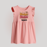 Bhaiya-Bhabhi Fun Rakhi Print Baby Frock – cartoon style with “Bhaiya-Bhabhi” text and playful elements. - BABY PINK - 0 - 3 Months Old (Chest 17")