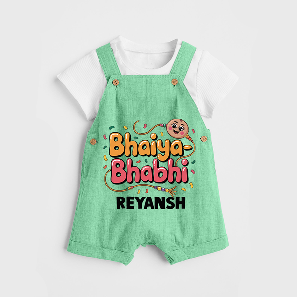 Bhaiya-Bhabhi Fun Rakhi Print Dungaree – cartoon style with “Bhaiya-Bhabhi” text and playful elements. - GREEN - 0 - 5 Months Old (Chest 18")