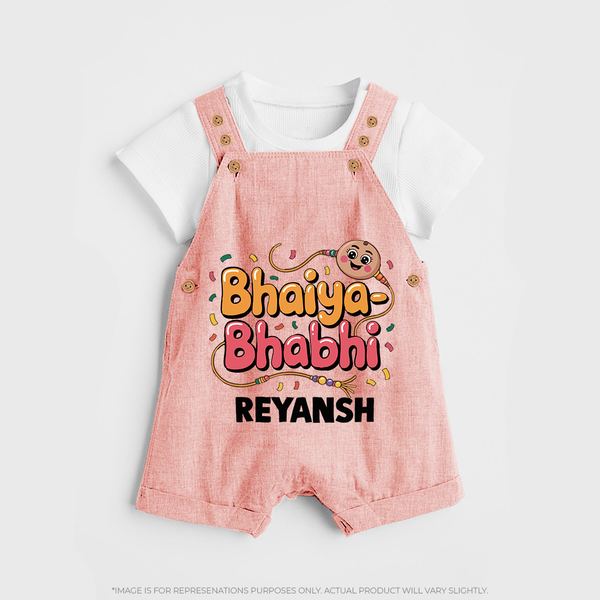 Bhaiya-Bhabhi Fun Rakhi Print Dungaree – cartoon style with “Bhaiya-Bhabhi” text and playful elements. - PEACH - 0 - 5 Months Old (Chest 18")