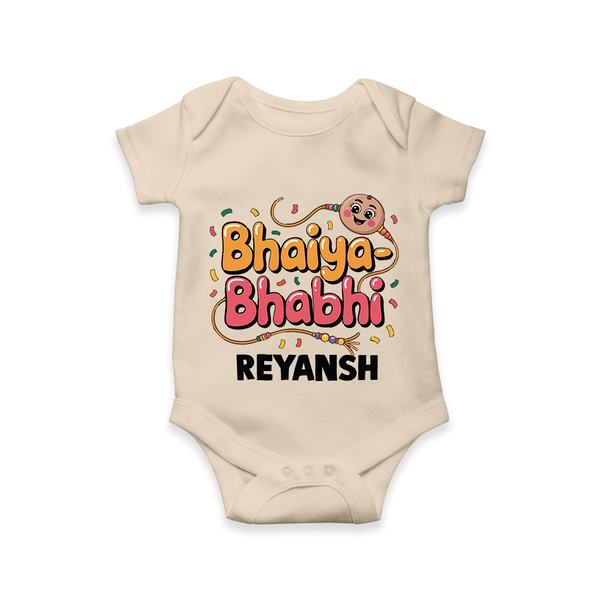 Bhaiya-Bhabhi Fun Rakhi Print Romper  – cartoon style with “Bhaiya-Bhabhi” text and playful elements. - IVORY - New Born (Chest 14")