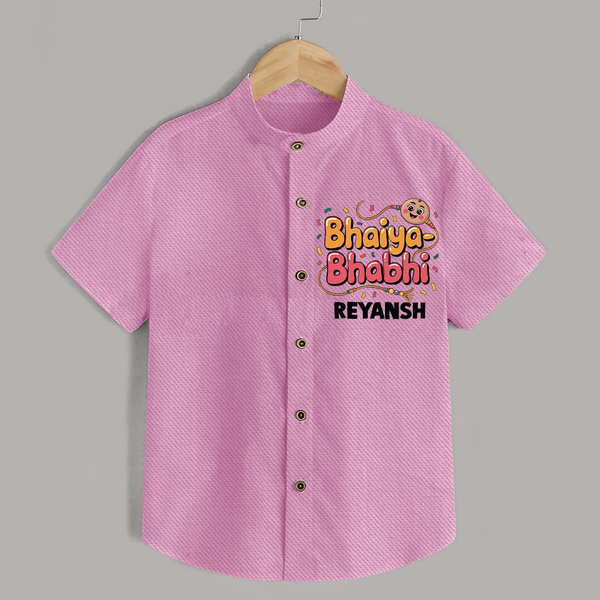 Bhaiya-Bhabhi Fun Rakhi Print Shirt – cartoon style with “Bhaiya-Bhabhi” text and playful elements. - BABY PINK - 0 - 6 Months Old (Chest 23")