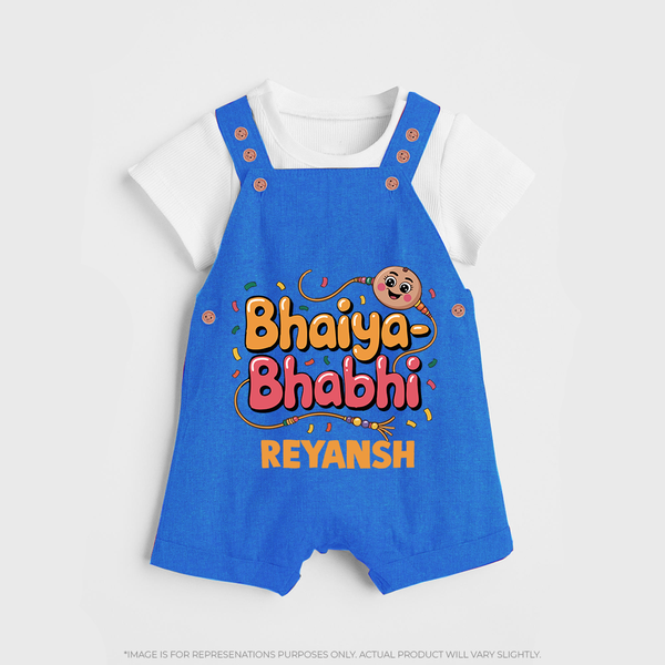 Bhaiya-Bhabhi Fun Rakhi Print Dungaree – cartoon style with “Bhaiya-Bhabhi” text and playful elements. - COBALT BLUE - 0 - 5 Months Old (Chest 18")