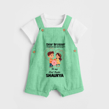 First Rakhi CelebrationBrother Sister Print Dungaree – simple baby holding rakhi illustration. - GREEN - 0 - 5 Months Old (Chest 18")