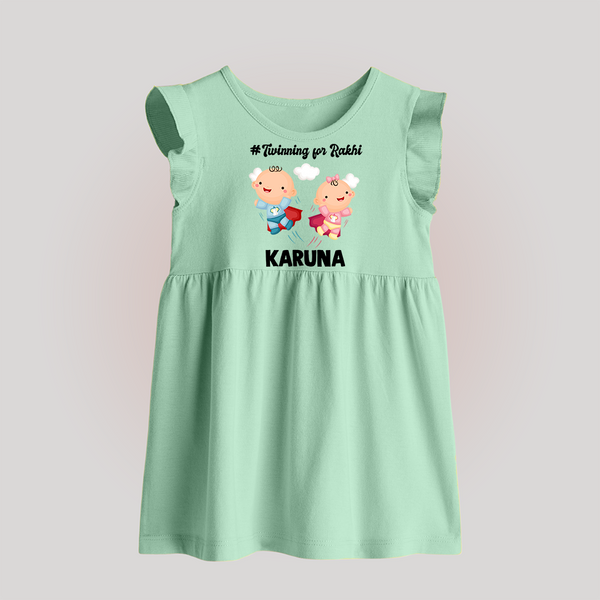 Twinning for Rakhi Print Baby Frock – two baby superheroes flying together. - MINT GREEN - 0 - 3 Months Old (Chest 17")