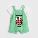 Pamper Me with Gift Rakhi Print Dungaree – brother-sister gift giving illustration. - GREEN - 0 - 5 Months Old (Chest 18")