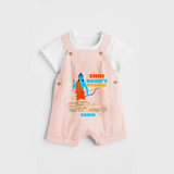 Make a bold entrance with our 'Shri Raam's Blessings' Customised Dungaree Set for Kids, designed to turn heads with its vibrant colors. - PEACH - 0 - 3 Months Old (Chest 17")