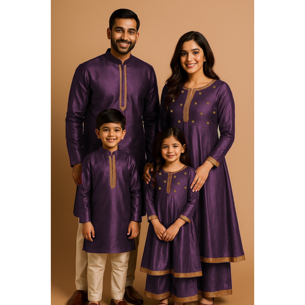 Indian family wearing coordinated raw silk ethnic outfits with golden lace detailing — dad in kurta, mom in Anarkali set, son in kurta, and daughter in frock with palazzo — festive family ethnic wear set.