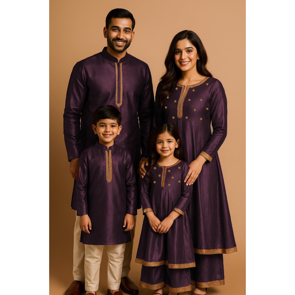 Indian family wearing coordinated raw silk ethnic outfits with golden lace detailing — dad in kurta, mom in Anarkali set, son in kurta, and daughter in frock with palazzo — festive family ethnic wear set.