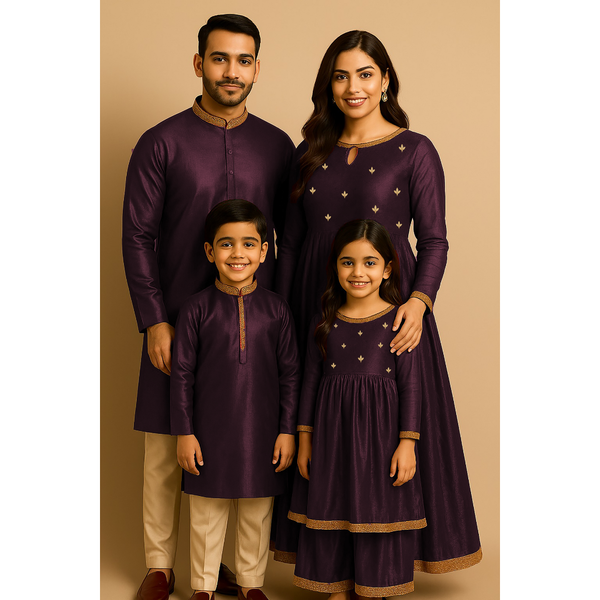 Indian family wearing coordinated raw silk ethnic outfits with golden lace embellishments — dad in kurta, mom in Anarkali set, son in kurta, and daughter in frock — festive family ethnic wear set.