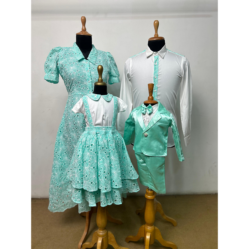 Mint green family matching outfit set with lace dress for mom, formal shirt for dad, suspender skirt for girl, and blazer set for boy.