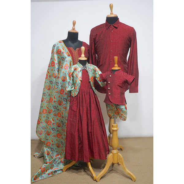 Coordinated maroon and aqua family outfit with dad shirt, mom kurta and dupatta, girl's dress and cape, boy's Nehru jacket and dhoti shorts